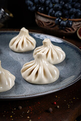 Khinkali – Traditional Georgian Dumplings. Traditional Georgian Bread. Traditional Georgian cuisine styled with authentic atmosphere.