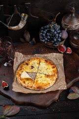 Meat Khachapuri – Georgian Bread with Savory Filling. Traditional Georgian Bread. Traditional Georgian cuisine styled with authentic atmosphere.