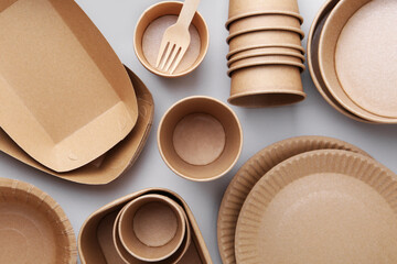 Set of disposable tableware on white background, flat lay