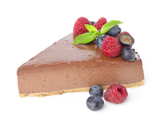 Piece of yummy chocolate cheesecake with berries isolated on white