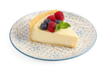 Piece of delicious cheesecake with fresh berries and mint isolated on white