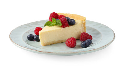 Piece of delicious cheesecake with fresh berries and mint isolated on white
