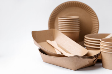 Set of disposable tableware on white background, closeup. Space for text