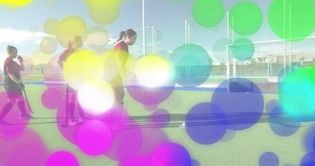 Coach signaling drill, teen dribbling ball toward goal, trapping and pushing during sports training - Powered by Adobe