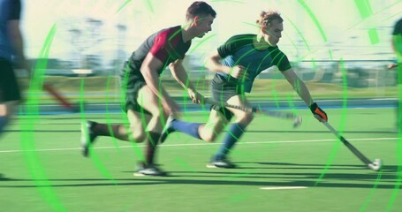 Black-uniformed player gathering hockey ball then dribbling into attack, data overlay tracing path - Powered by Adobe