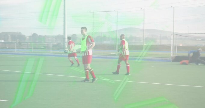 hockey forwards dribbling ball into circle bypassing defender, keeper diving, players probing lanes