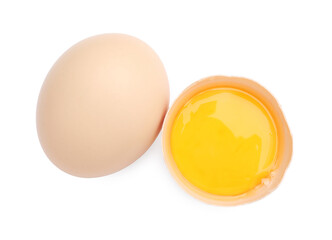 Whole and broken chicken eggs isolated on white, top view