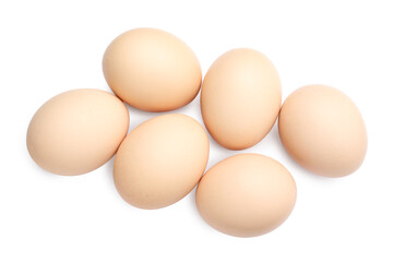 Many raw chicken eggs isolated on white, top view
