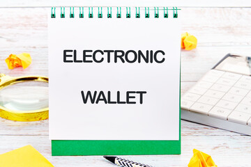 Business, programming, interface, application and network concept. Text ELECTRONIC WALLET in an upright notebook