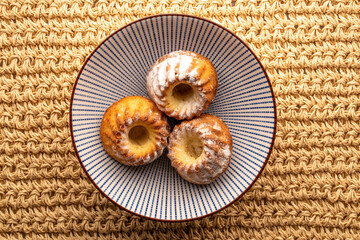 Homemade sweet cupcakes on the table, close-up, top view.