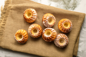 Homemade sweet cupcakes on the table, close-up, top view.