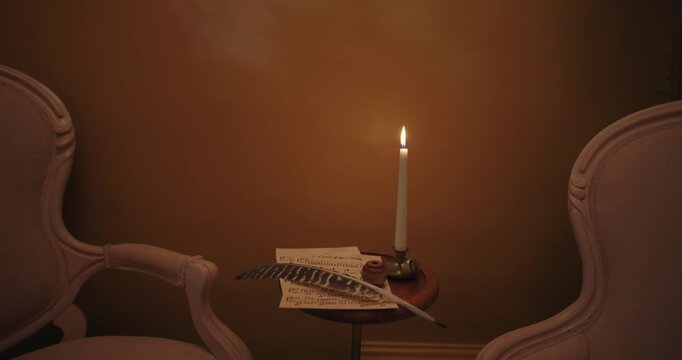 Candlelit parlor with quill pen and sheet music between two armchairs
