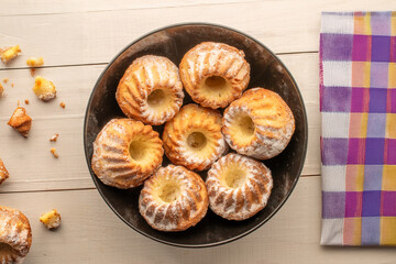 Homemade sweet cupcakes on the table, close-up, top view.