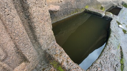 Engineering of the Ancients: Detailed View of a Carved Water Reservoir Used for Monastic Drinking Supply at the Historic Kanheri Caves Complex, Mumbai, India 