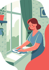 Woman dusting the windowsill with a cloth in a cozy interior, cheerful atmosphere