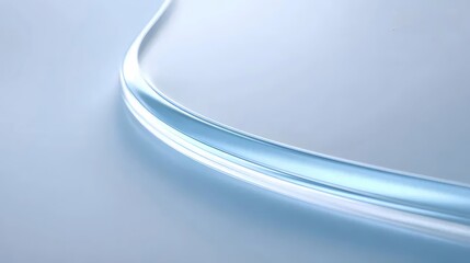 柔らかい灰色の表面に湾曲した青い光ファイバー