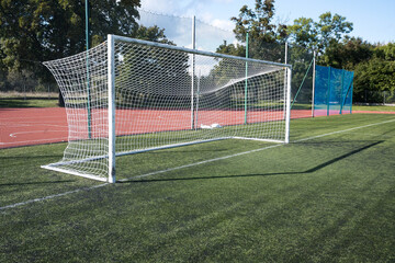 Fototapeta premium Goal with net on a football field, sport. 