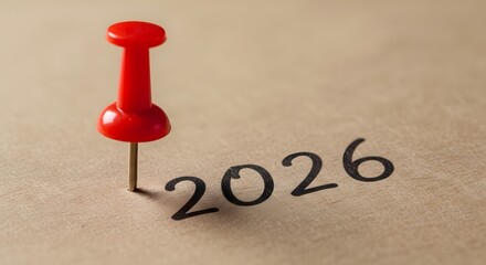 Marking Time A bright red pin marks the year 2026, signifying planning or remembering a future event.