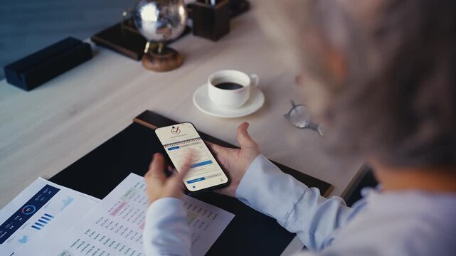 Female office worker voting online on phone, upset at bug and election fraud