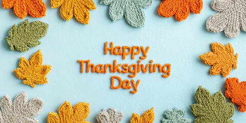 Happy Thanksgiving Day Greeting With Knitted Colorful Leaves On Blue Background. Concept Of Seasonal Holiday Celebration, Autumn Craft Aesthetics, DIY Decor Trends, And Festive Thanksgiving Design