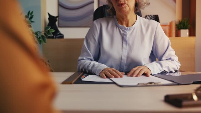 Senior female manager accepting bribe money at meeting, workplace corruption