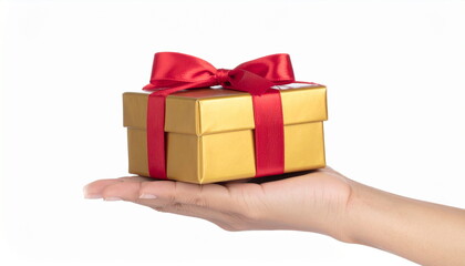 Obraz premium Hand Holding Gold Gift Box with Red Ribbon on White Background