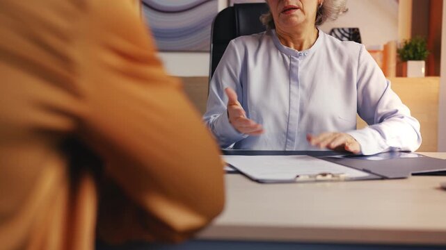 Shocked senior female official refusing bribe offer, demonstrating probity