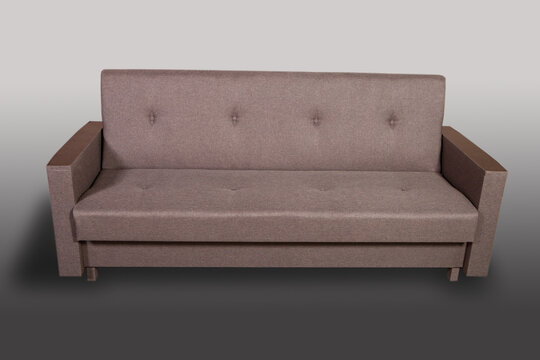 Isolated sofa bed with fabric upholstery on grey gradient background.