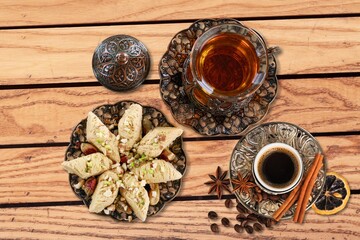 Traditional plate with sweet date fruits and tea