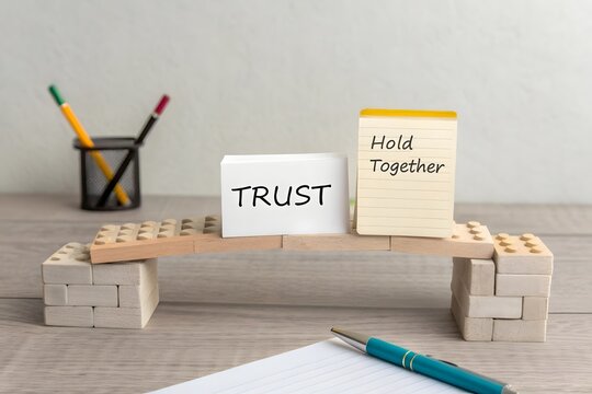 A wooden bridge supported by blocks showing trust and togetherness