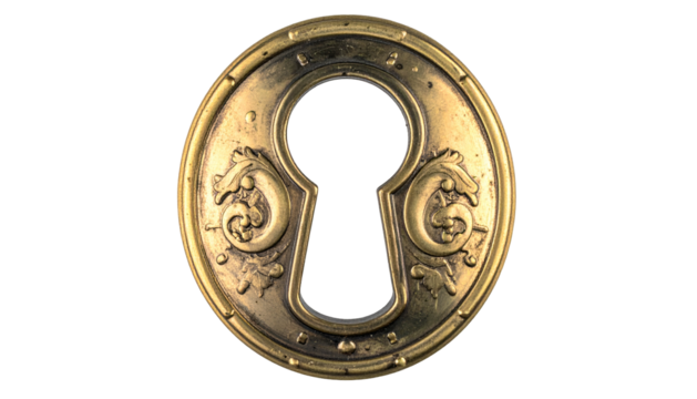 Close-up of an antique brass keyhole escutcheon with ornate design