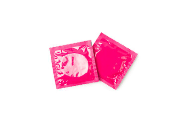 Condoms isolated on white background. Colorful fruit-colored condoms in packaging. Safe sex concept. Contraceptive. Different birth control methods. Aids prevention. World AIDS Day. Sexual health.