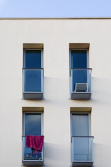 Geometric facade with little balconies and vintage streetlight