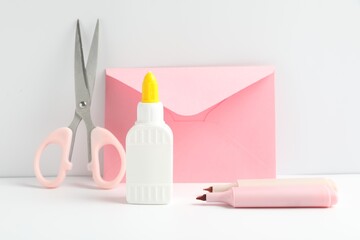 Glue and other stationery on white table