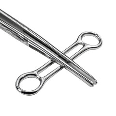 Surgical tools displayed on a clean surface, showcasing precision instruments used in medical procedures