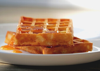 Close-up of fresh Belgian waffles - A Pile of Golden-Brown Waffles Ready for a Delicious Breakfast