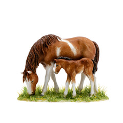 A brown and white horse grazes in a green field as its brown foal stands nearby. The scene depicts a quiet moment between a mother and her young offspring