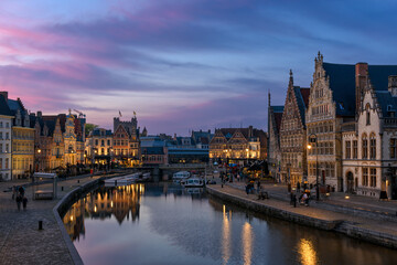 View of Graslei, Korenlei quays and Leie river in the historic city center in Ghent (Gent), Belgium. Architecture and landmark of Ghent. Sunset cityscape of Ghent.