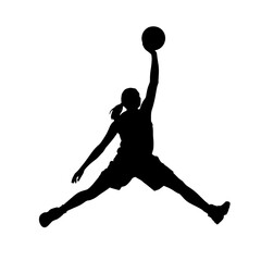 Athlete performs a slam dunk in mid-air during a basketball game at a local gym in the evening