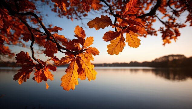 Vibrant autumnal oak leaves frame a serene lake scene at sunset. - Powered by Adobe