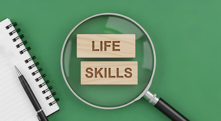 Magnifying Glass Over Wooden Blocks With Life Skills Written On Them A Notebook And Pen Are Nearby