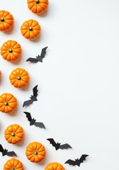 Minimal Halloween Flat Lay with Pumpkins and Bats on White Background