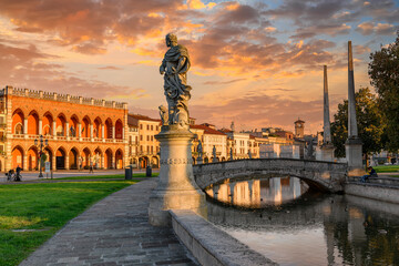 View of canal with statues on square Prato della Valle and Lodge Amulea also known as Ca' Duodo Palazzo Zaccoin Padova (Padua), Veneto, Italy. Architecture and landmarks of Padua.
