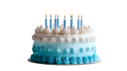 A blue ombre birthday cake with white frosting and lit candles on a black background for celebration