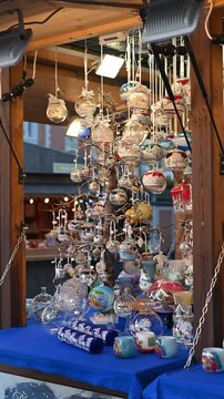close up of christmas market stalls with festive decorations and handmade gifts