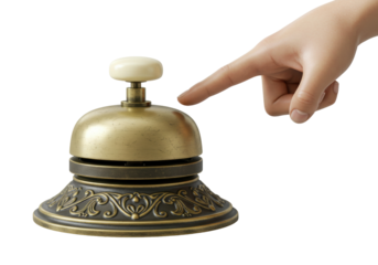 Brass reception bell isolated, finger pressing the top button to call for service, vintage hotel concierge equipment