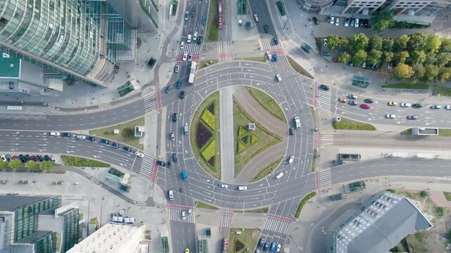 Aerial drone view of ONZ Roundabout in Warsaw city center with busy traffic and modern buildings