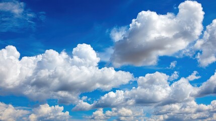 Bright and Serene Sky with Fluffy Clouds and Vibrant Blue Background