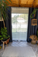 rustic greenhouse living room with tropical foliage for concepts of comfort  serenity and eco-friendly interior