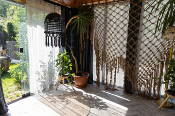rustic greenhouse living room with tropical foliage for concepts of comfort  serenity and eco-friendly interior